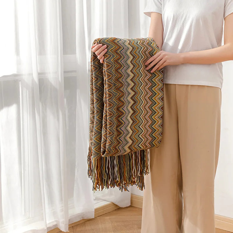 Cozy striped tassel throw blanket, breathable and stylish for inviting boho home decor.