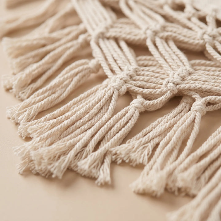 Comfortable boho tasseled cotton hammock ideal for patio or backyard relaxation, a chic outdoor furniture piece.