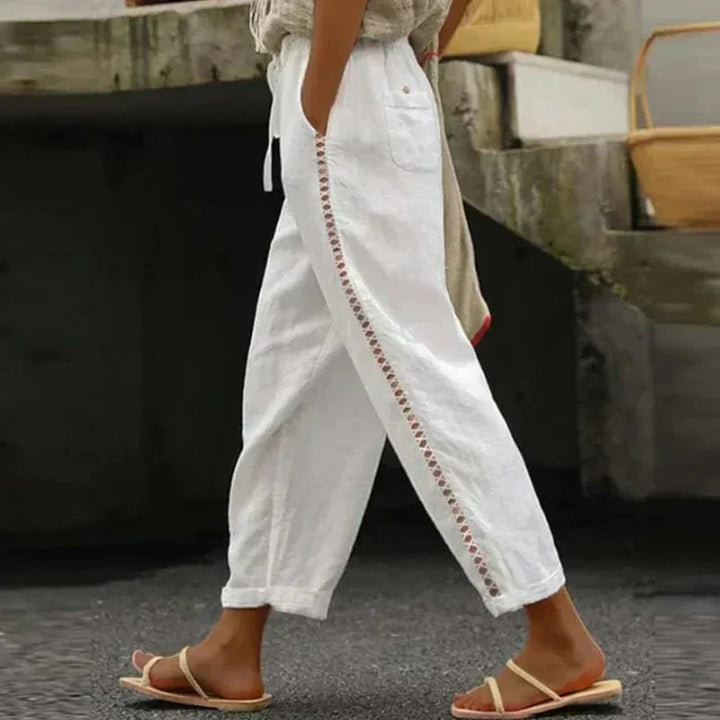 Boho women's loose fit summer trousers with vibrant bohemian print, ideal for a casual beach or festival look.