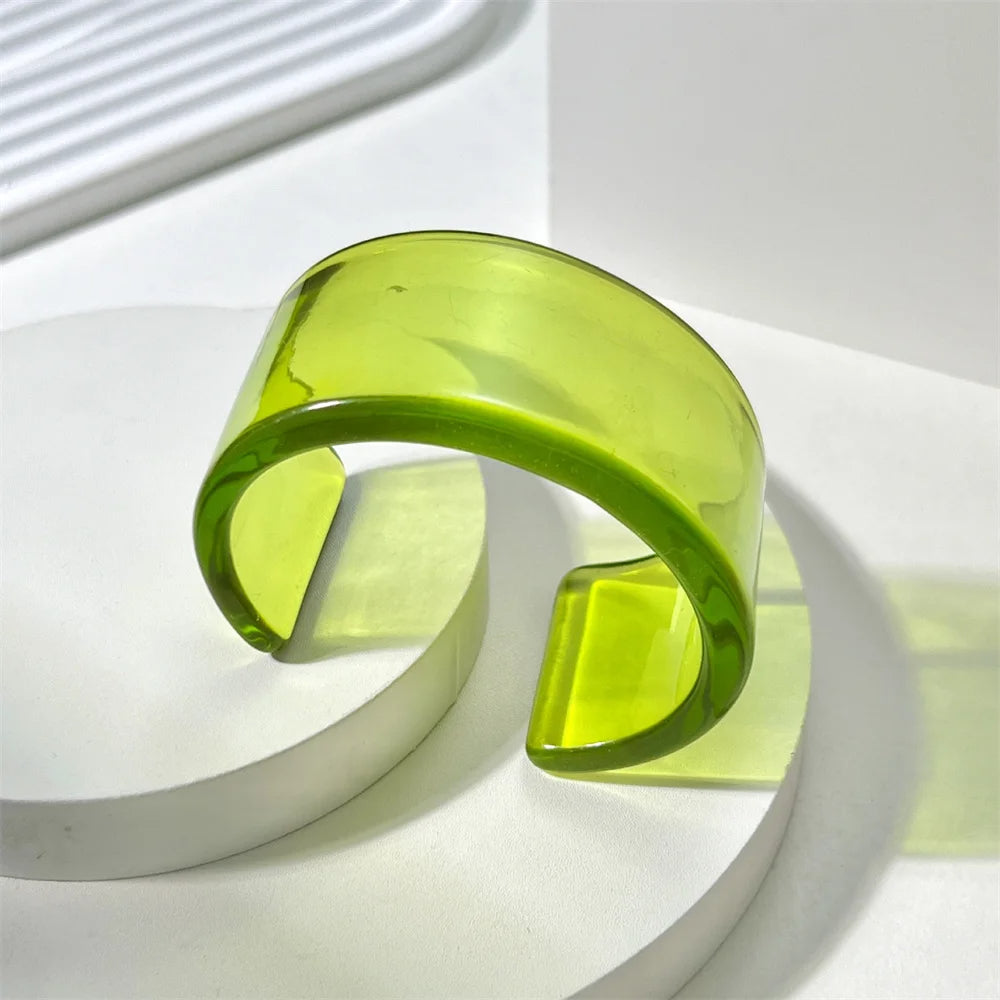 Women's bold acrylic chunky cuff bangle bracelet, colorful glossy statement accessory.