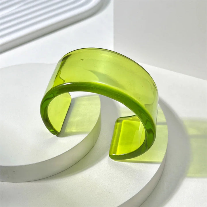 Women's bold acrylic chunky cuff bangle bracelet, colorful glossy statement accessory.