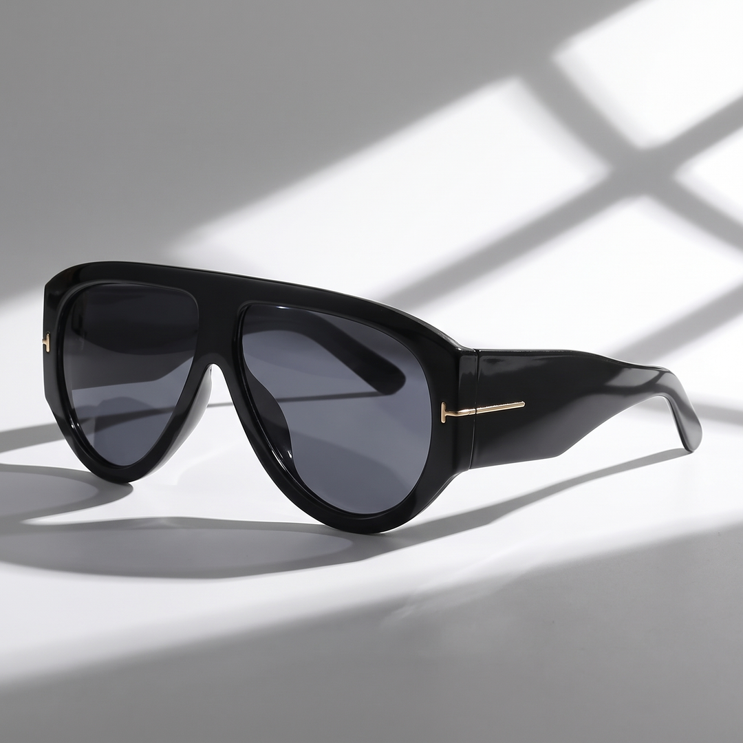 Bold color-blocked oversized women's sunglasses with gold detail. UV protection trendy fashion accessory.