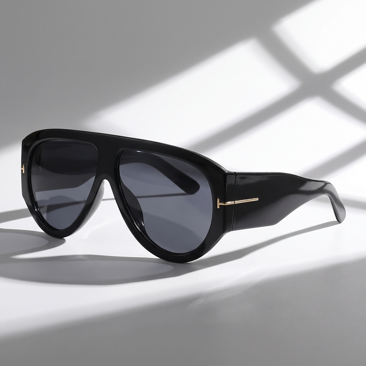 Bold color-blocked oversized women's sunglasses with gold detail. UV protection trendy fashion accessory.