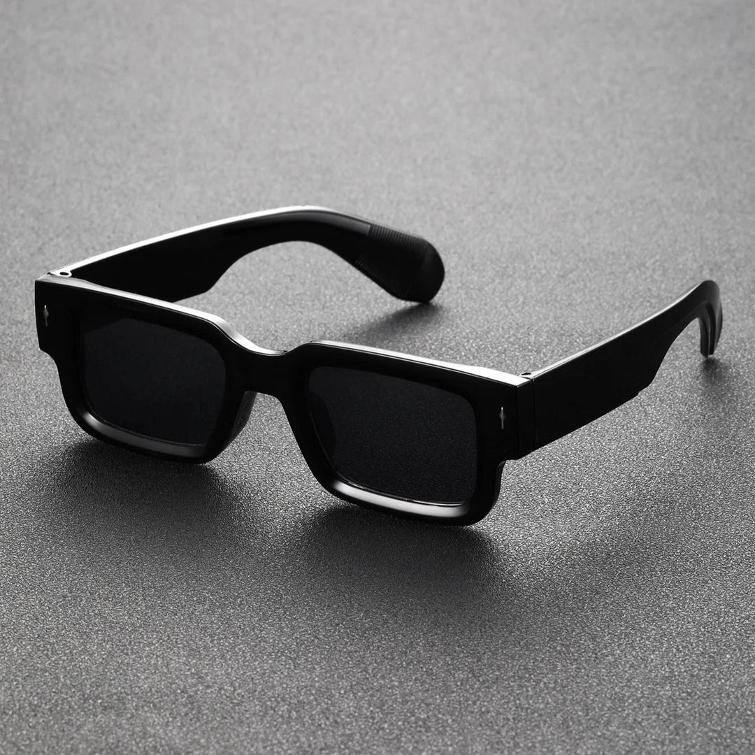 Unisex bold rectangular statement sunglasses. Fashion-forward eyewear accessory with essential UV protection.