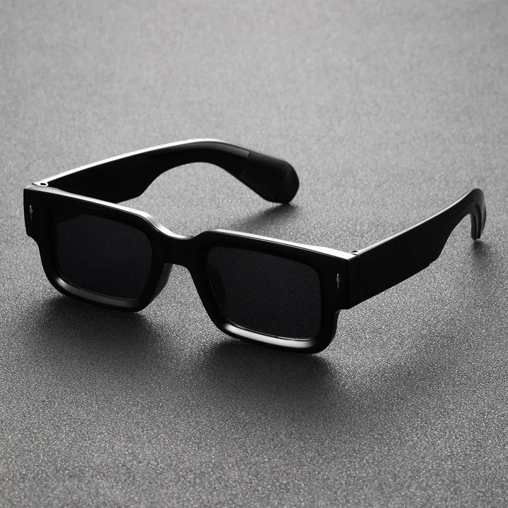 Unisex bold rectangular statement sunglasses. Fashion-forward eyewear accessory with essential UV protection.