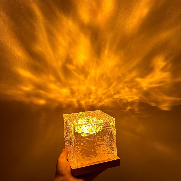 Desk setup featuring a Borealis Cube LED lamp, adding a touch of ambient light