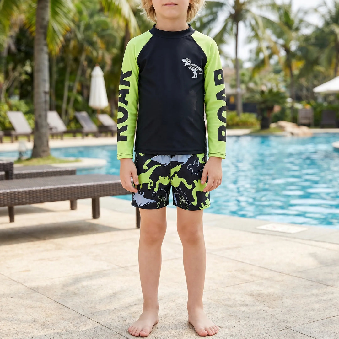 Boys' dinosaur rash guard swimsuit set. Two-piece design offers UPF 50+ sun protection for active play.