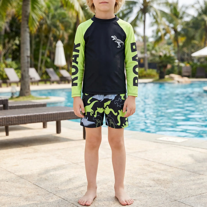 Boys' dinosaur rash guard swimsuit set. Two-piece design offers UPF 50+ sun protection for active play.