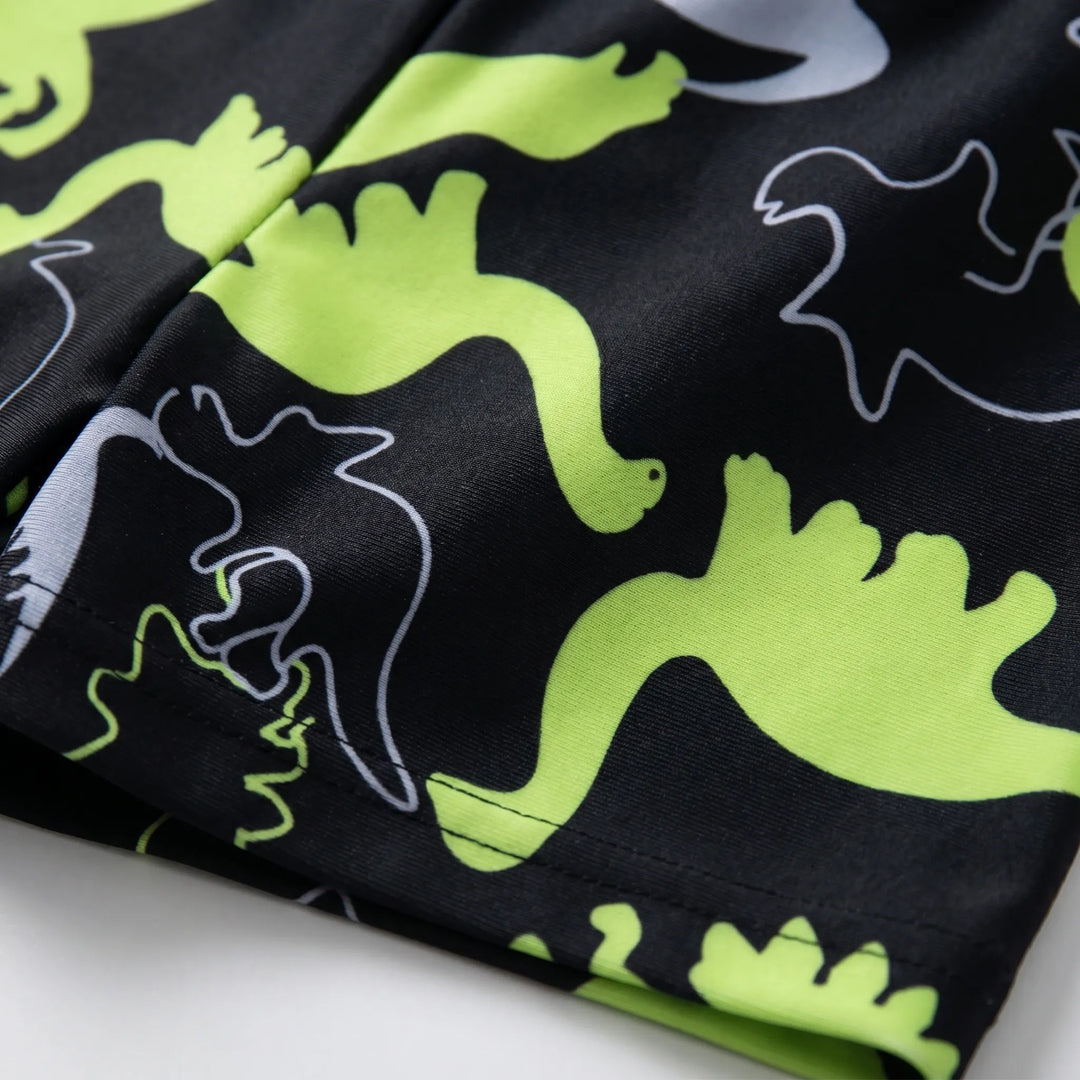 Toddler boys' dinosaur rash guard and swim trunks set, offering comfort and UPF sun protection for active kids.