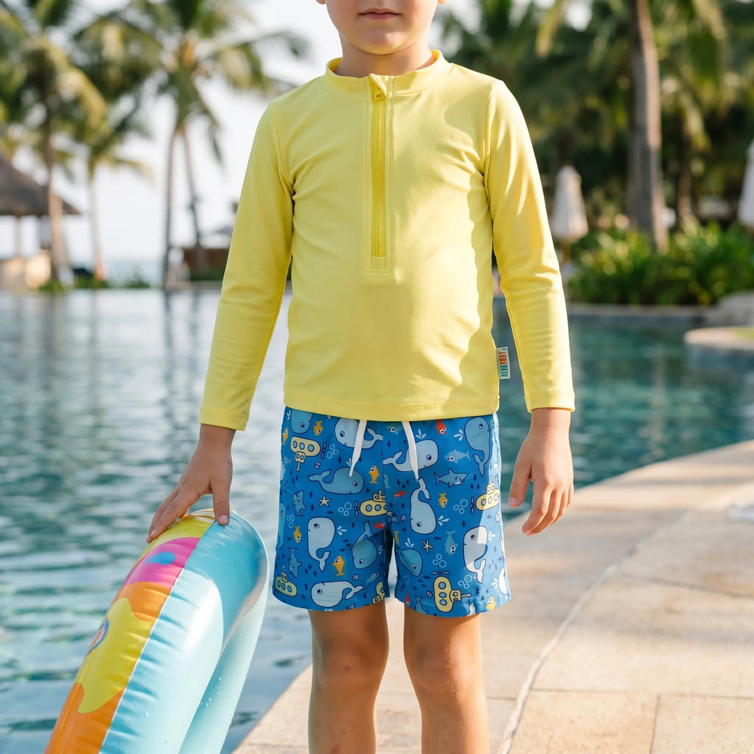Boys' long sleeve sun protection swimwear set with rash guard and matching swim trunks for beach days.