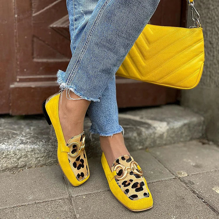 Bright yellow slip-on women's loafers with elegant penny toe design, perfect for comfortable casual or everyday wear.