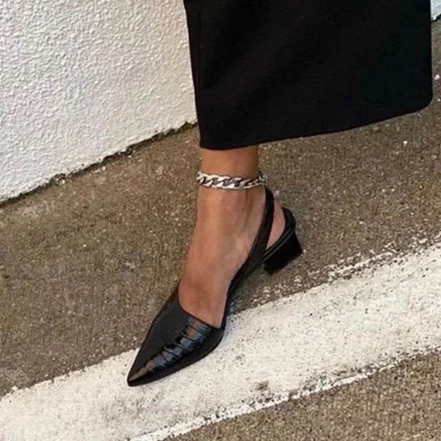 Black orthopaedic mid heels with stylish croco texture, women's comfortable pumps for office or events.