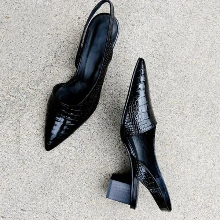 Comfortable black orthopaedic mid heel pumps featuring a chic croco print, perfect for women's formal shoes.