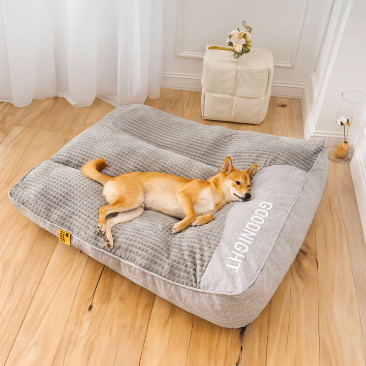 Gray tear-resistant orthopedic dog bed with supportive cushion ensures pet comfort and joint support for canines.
