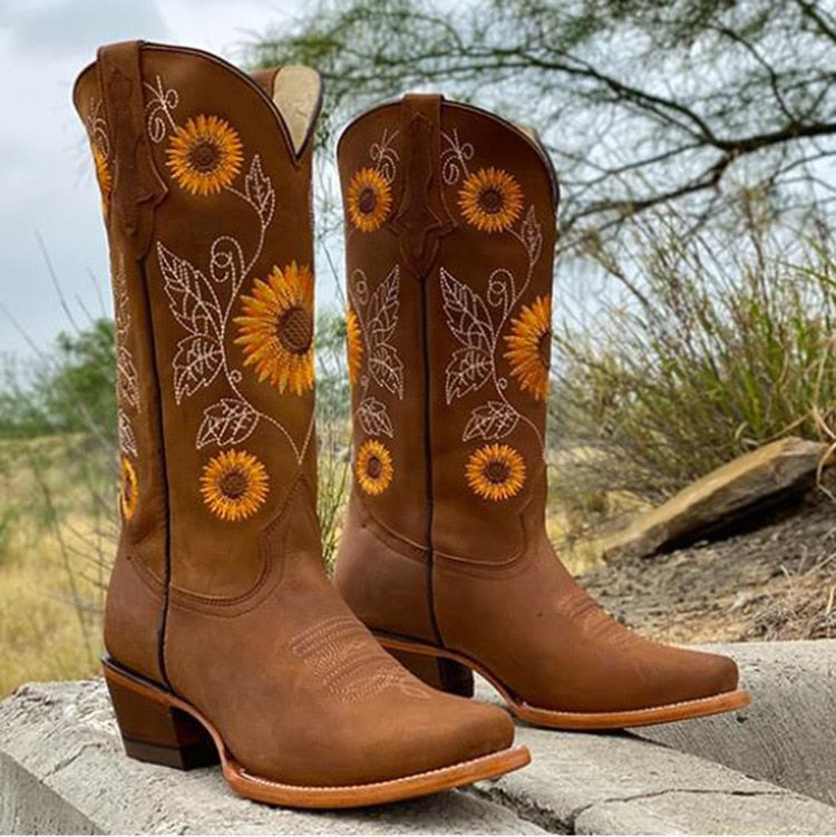 Women's brown Ibiza spirit boots with a vibrant sunflower pattern. Ideal for boho festival wear & casual fashion.