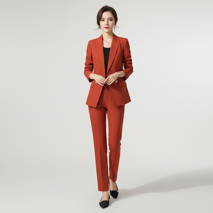 Women's two-piece blazer and trousers set in burgundy, showcasing the tailored fit