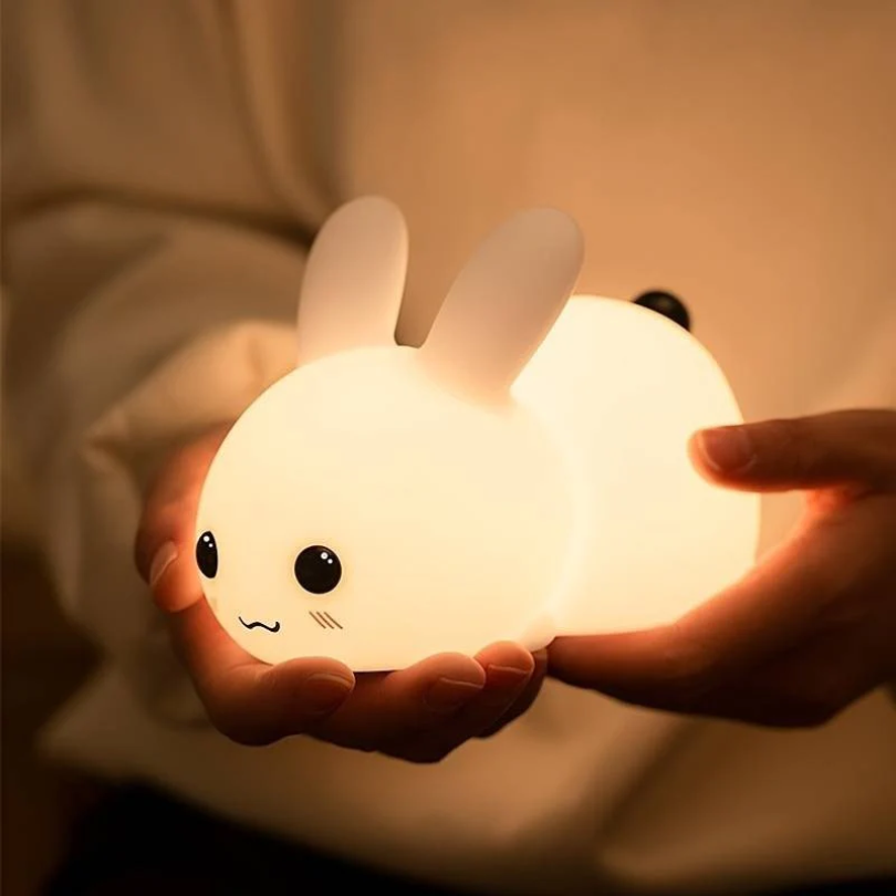 Calming bunny night light for children's rooms, providing a soft glow for peaceful sleep. Ideal nursery decor.