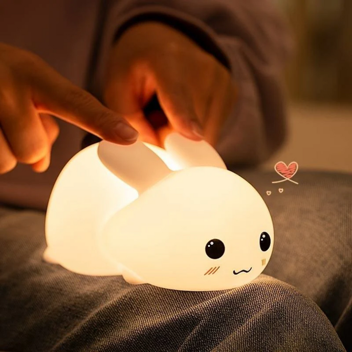 Adorable SnuggleBunny lamp, a gentle sleep aid for kids. Perfect baby gift and nursery night light.