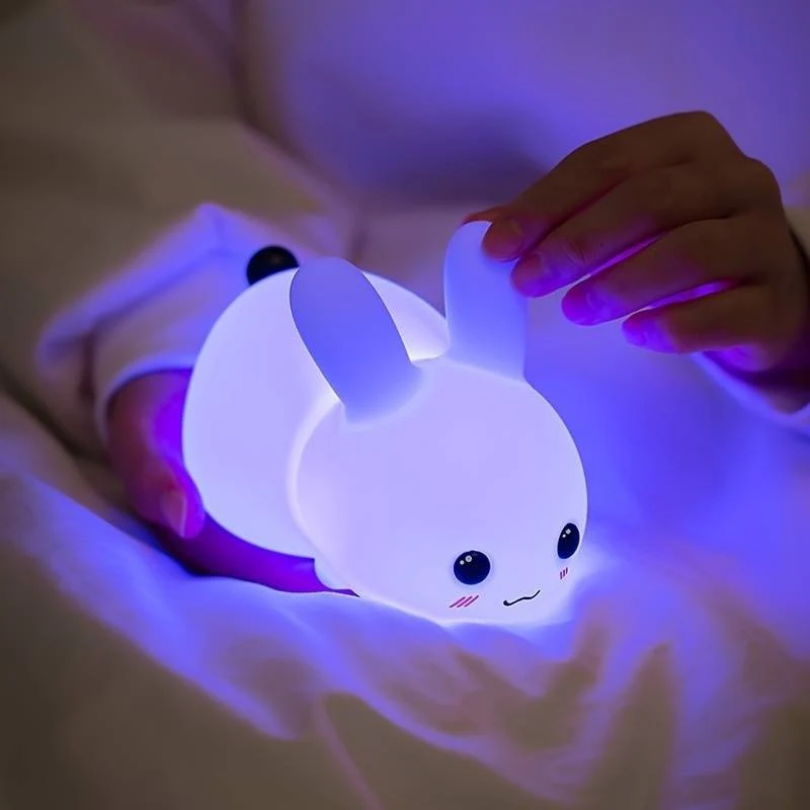 Cute bunny night light for children, offering a comforting soft glow. Enhances nursery decor & aids sleep.