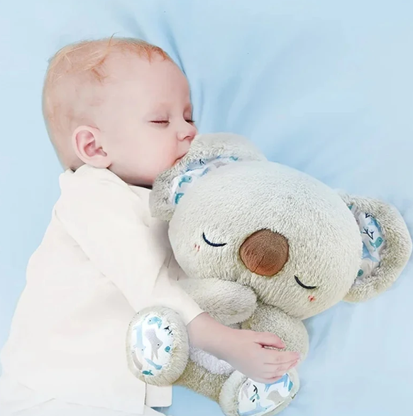 Unisex koala sleep aid with gentle breathing motion & soothing night light for stress reduction.