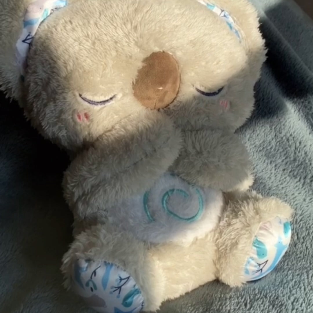 Stress-reducing koala plush toy, a gentle breathing aid & sleep companion for relaxation.