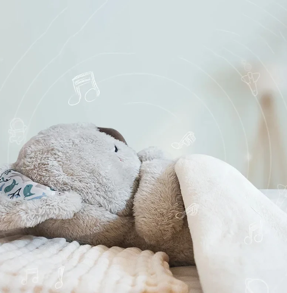 Cute koala relaxation toy providing calming breathing movements & a soft glow for better sleep.