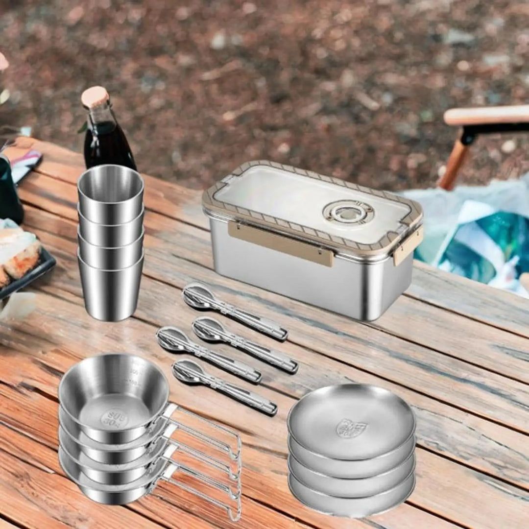 Outdoor dining set: Stainless steel plates, bowls & cups in a compact storage box for camp kitchen.