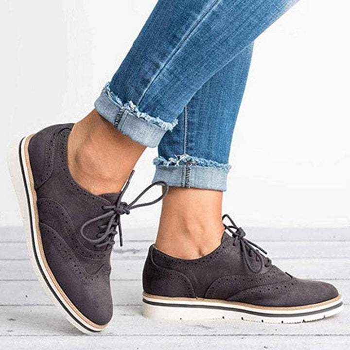 Stylish women's suede brogue Derby shoes, Carisse, offering a blend of classic and contemporary fashion.