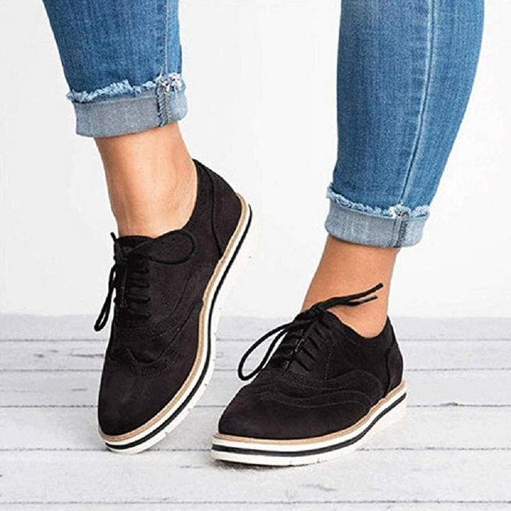 Casual yet chic women's flat suede Derby shoes with brogue details from Carisse, a comfortable footwear choice.
