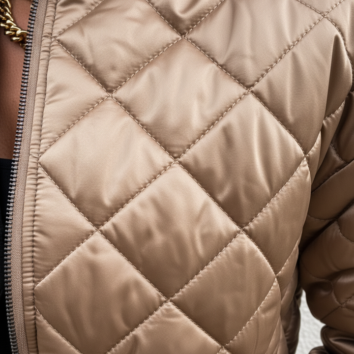Close-up of the quilted detail on a Carla women's padded bomber jacket, ideal for cold weather