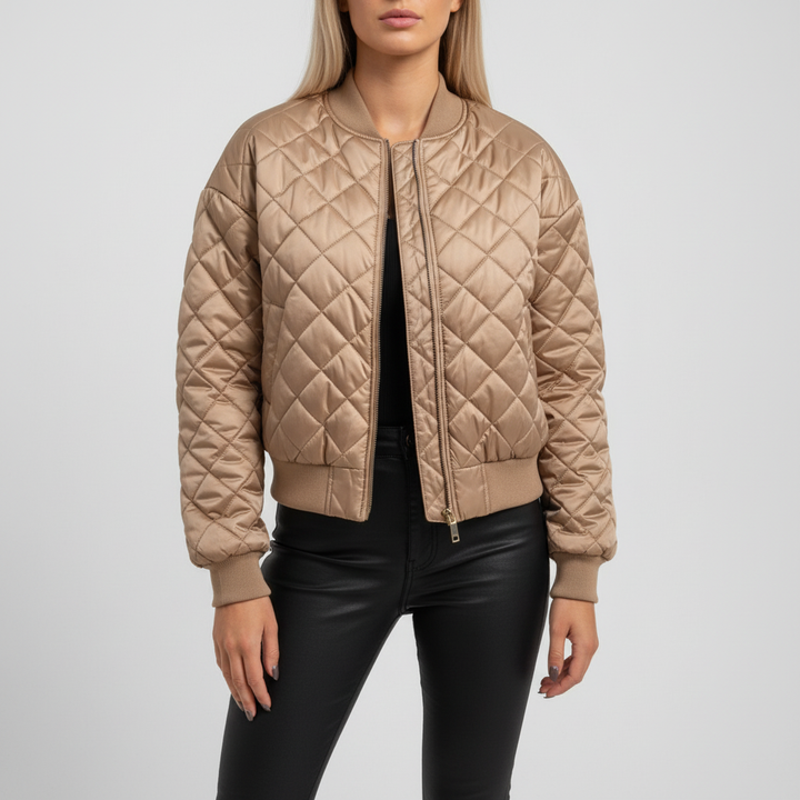 Model wearing a fashionable Carla women's padded bomber jacket, suitable for casual winter outfits