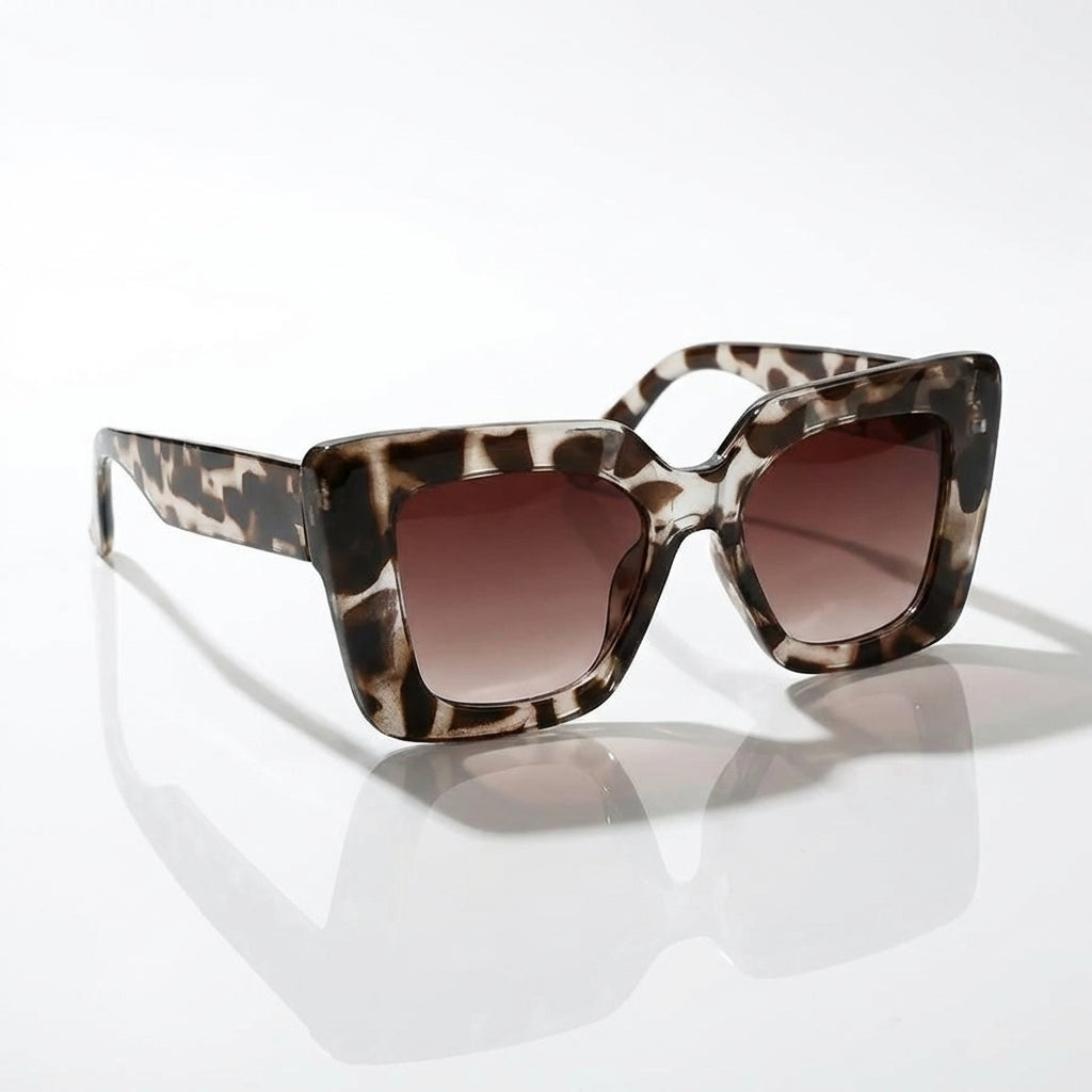 Black grey Carlotta square fashion sunglasses for women. Modern eyewear with sleek, dark lenses.