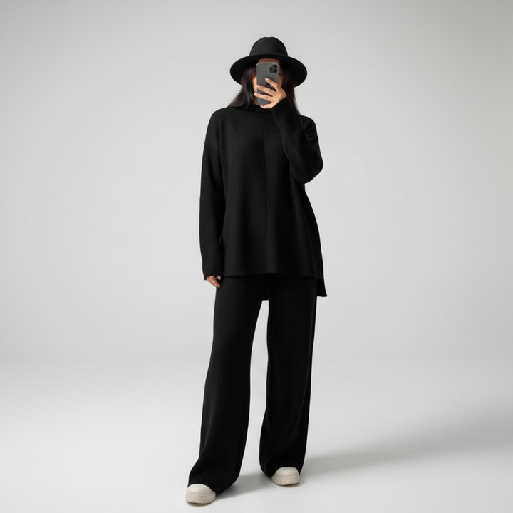 Stylish women's comfort clothing: a knit lounge set with a crew-neck top and chic wide-leg pant design.