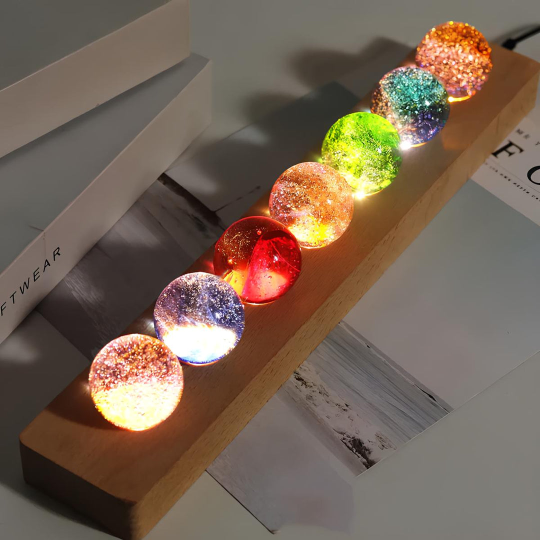 Hand holding a glowing AstroGlow Orb, emphasizing its portable and radiant design