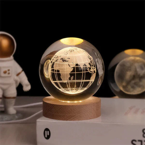 Hand holding CelestialGlow Crystal Sphere Night Light, showcasing portability and intricate details