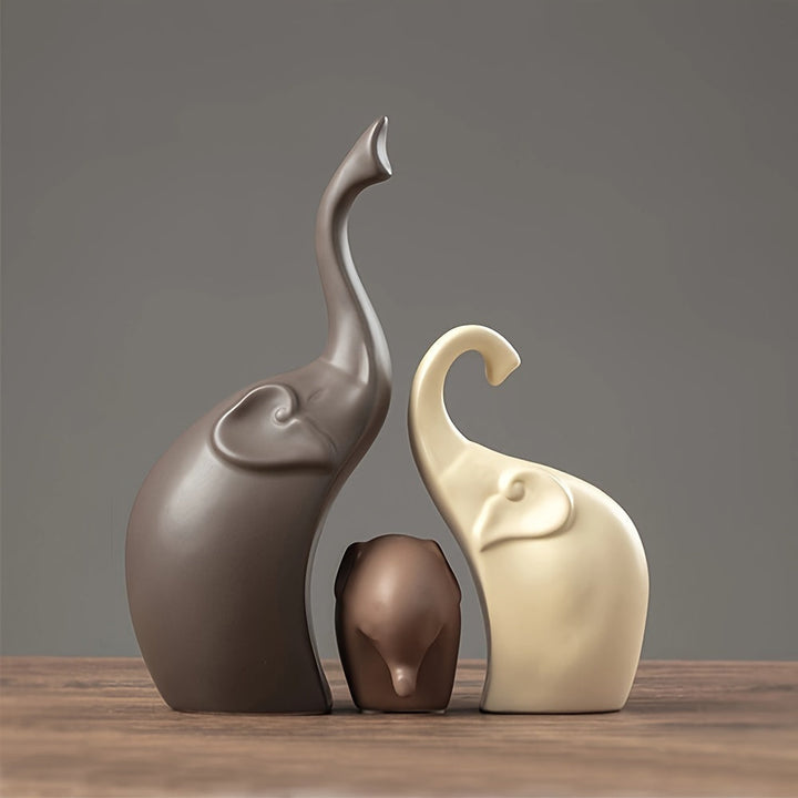Set of 3 ceramic elephant statues: mother, father, baby. Modern sculpture for home & garden decor.