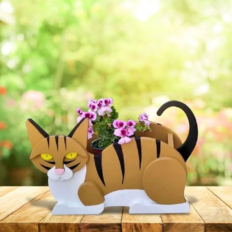 Cute cat-shaped garden planter, a charming backyard accent for outdoor plants.