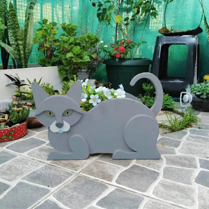 White plastic cat animal planter, a charming pot for whimsical garden decor & plants.