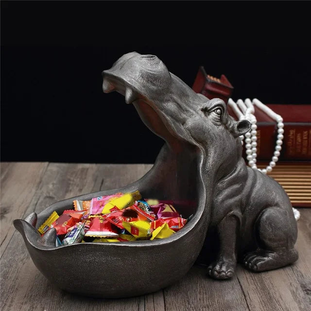Decorative hippo figurine storage box, a unique tabletop accent for home or office decor.