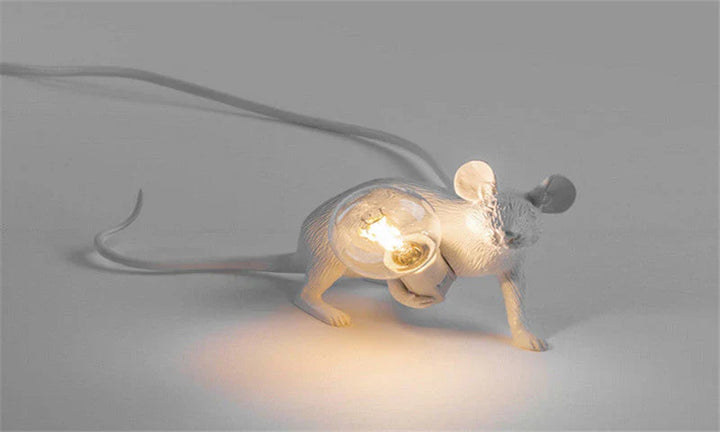 Cute white resin mouse table lamp with exposed LED bulb, ideal as a bedside or accent animal lamp.