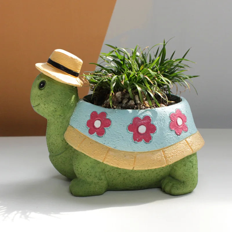 Charming turtle plant pot for home & garden decor. Cute animal planter, perfect for succulents or small plants indoors.