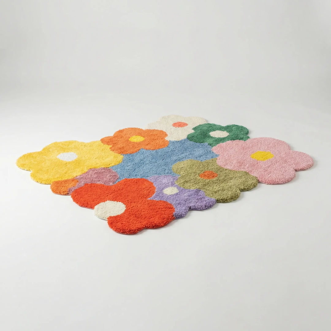 Flowique statement floral area rug with playful meadow design. Soft, whimsical floor covering for stylish rooms.