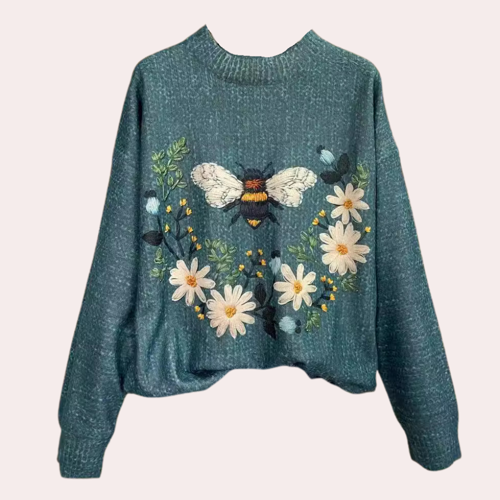 Cheerful women's floral print sweater, perfect for spring fashion & comfortable casual wear.