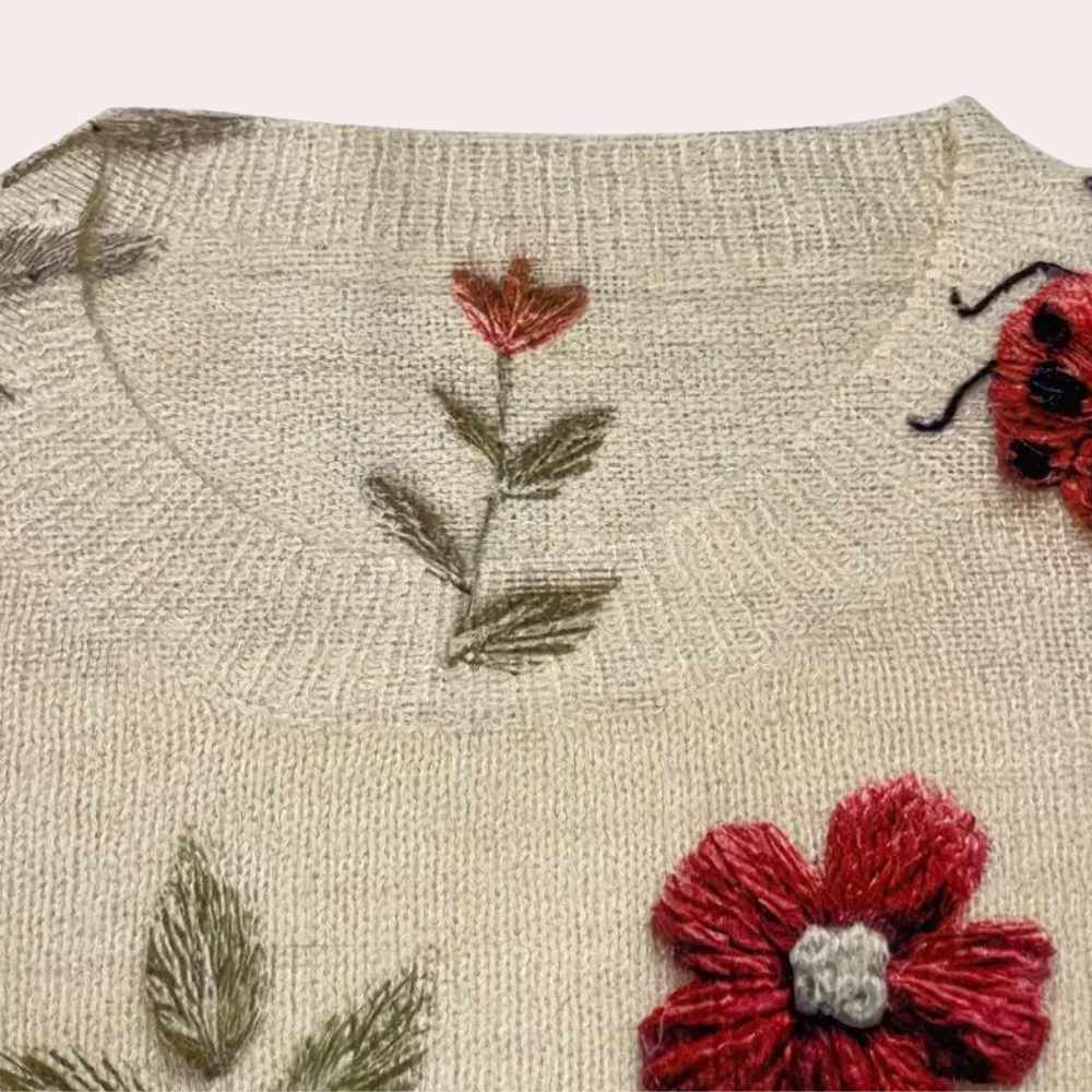Vibrant floral print women's sweater, cheerful design for spring fashion.