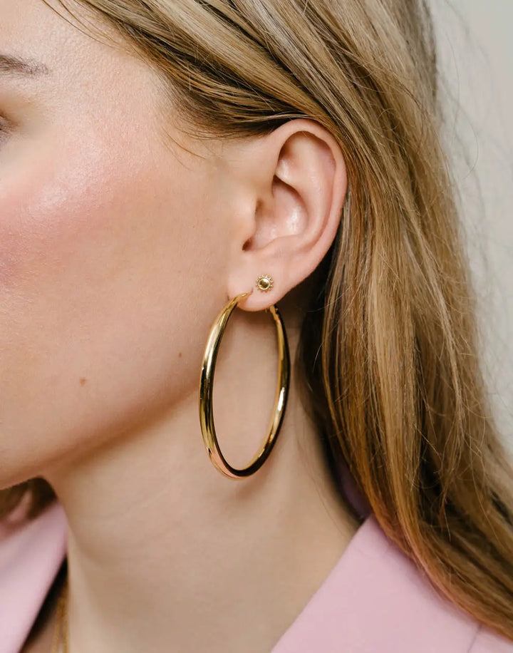 Chic 2.36-inch gold-plated hoop earrings with lever back for women. Hypoallergenic statement jewelry.