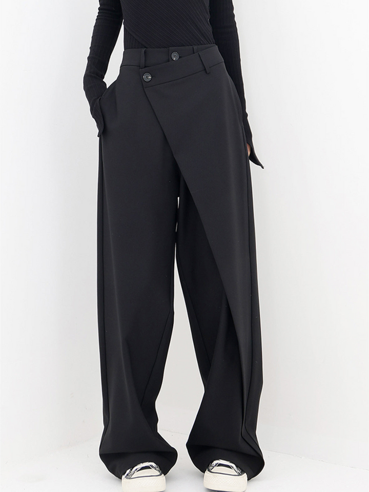 Chic asymmetrical women's baggy trousers with a modern low-waist design. Comfortable & stylish contemporary pants.