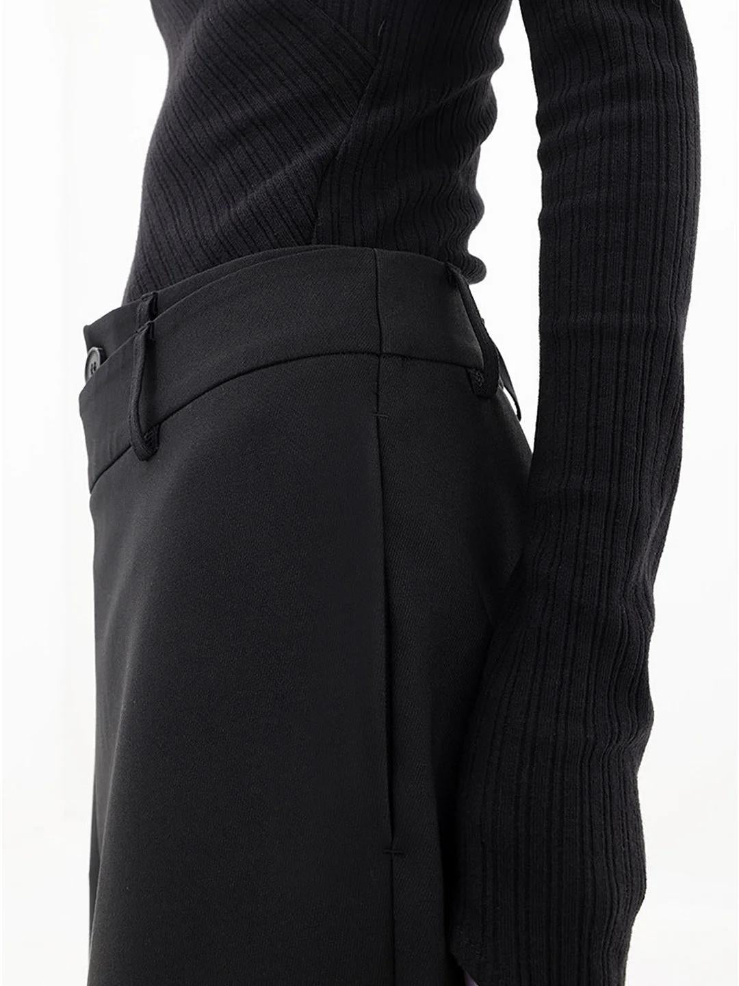 Modern baggy women's pants with chic asymmetrical detailing & a low-waist cut. Versatile casual trousers.