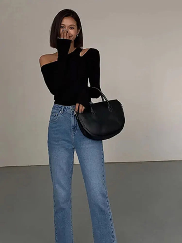 Stylish women's off-shoulder black long sleeve top, ideal for a chic and versatile everyday look.