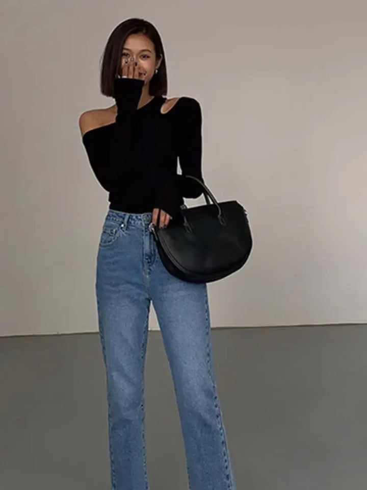 Stylish women's off-shoulder black long sleeve top, ideal for a chic and versatile everyday look.