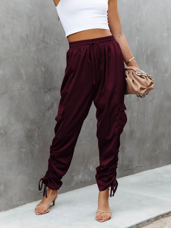 Women's elegant red satin cargo pants, offering a chic look for effortless day-to-night fashion.